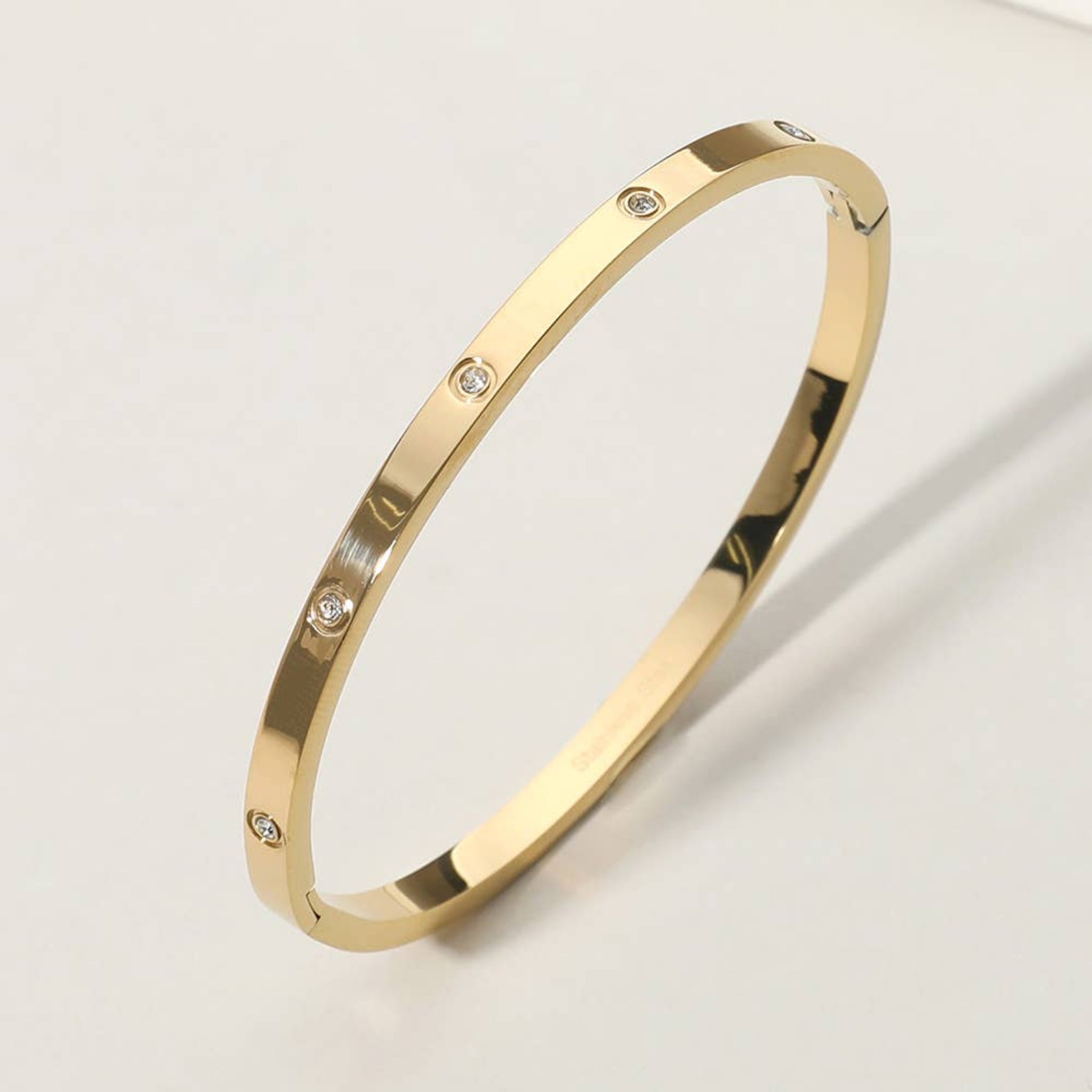 Stainless Steel Stone Paved Hinged Bangle Bracelet | Gold